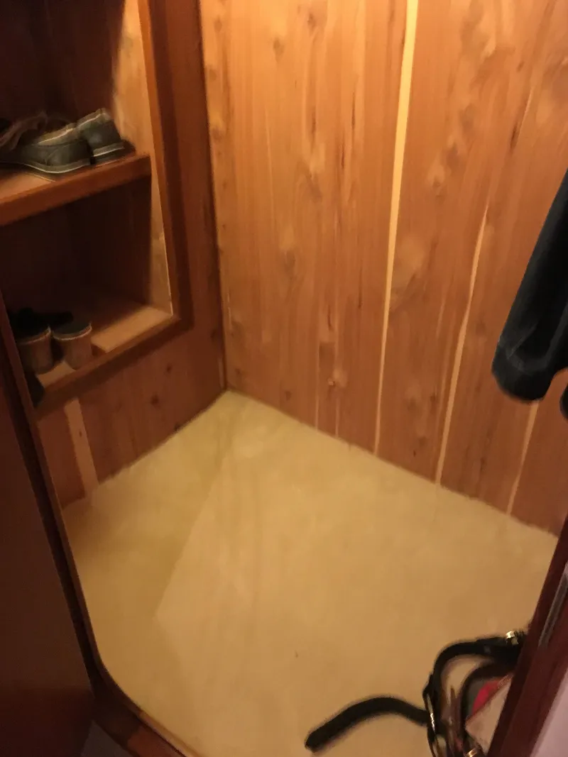 Slide: The Image of Wood-paneled closet interior on 2001 Ocean Yachts 56 Super Sport. - 34