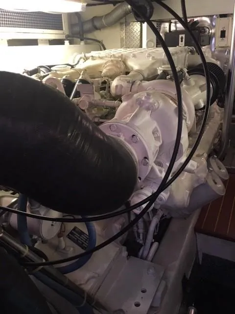 Slide: The Image of Engine room of 2001 Ocean Yachts 56 Super Sport, showcasing powerful marine engine components. - 44