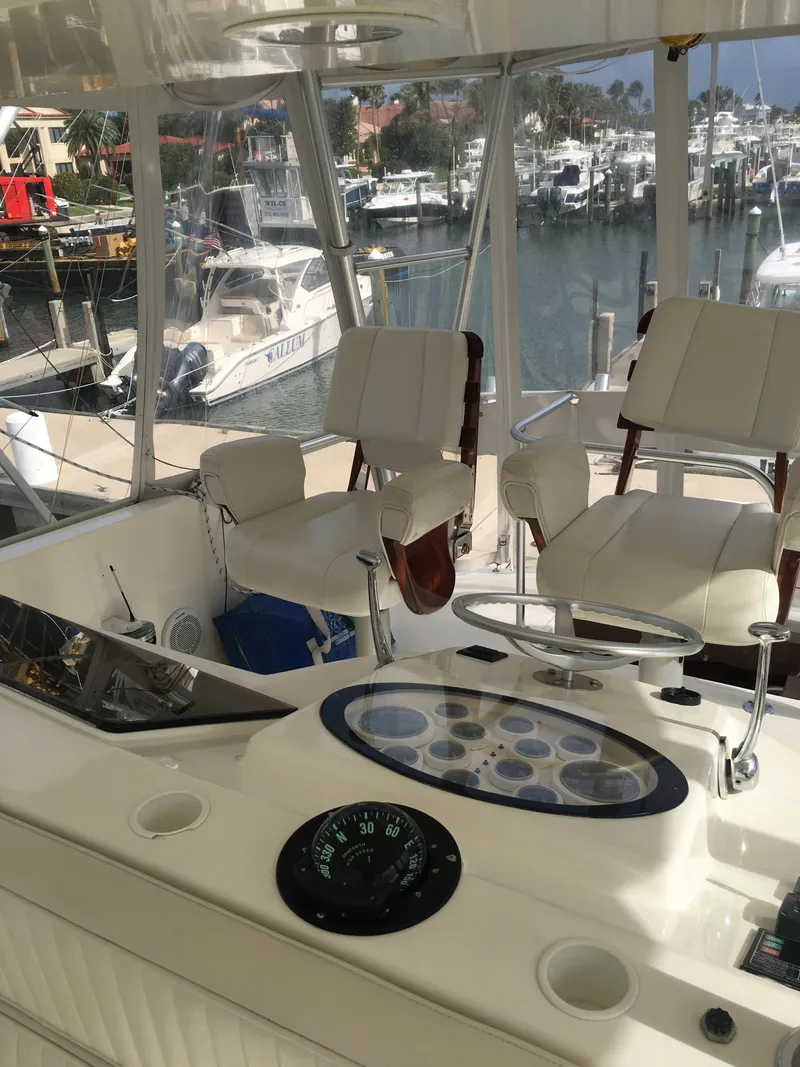 Slide: The Image of 2001 Ocean Yachts 56 Super Sport cockpit with marina view. - 5