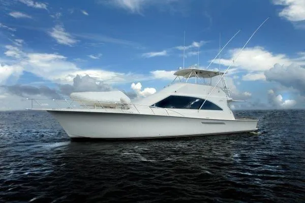 The Image of 2001 Ocean Yachts 56 Super Sport cruising on open water under a blue sky. - 0