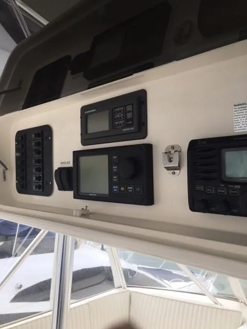 Slide: The Image of Control panel of 2001 Ocean Yachts 56 Super Sport with navigation instruments. - 12