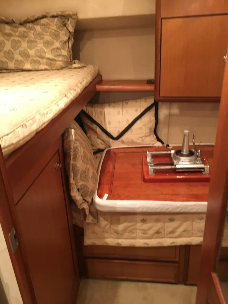 Slide: The Image of Cozy cabin interior of 2001 Ocean Yachts 56 Super Sport with wooden furnishings. - 21