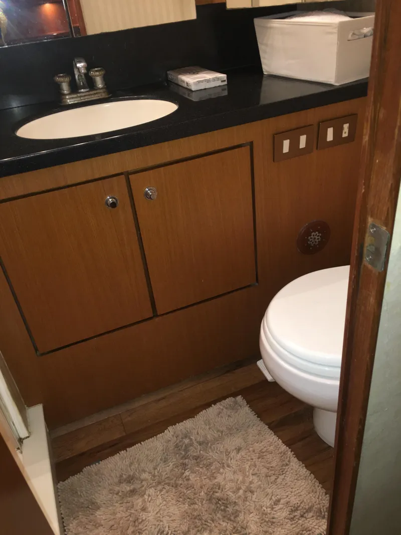 Slide: The Image of Bathroom interior of 2001 Ocean Yachts 56 Super Sport with sink and toilet. - 39