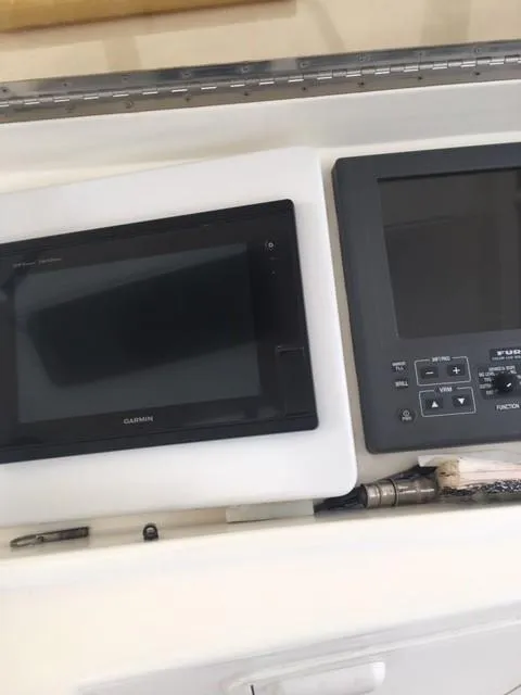 Slide: The Image of Control panel of a 2001 Ocean Yachts 56 Super Sport with navigation screens. - 9