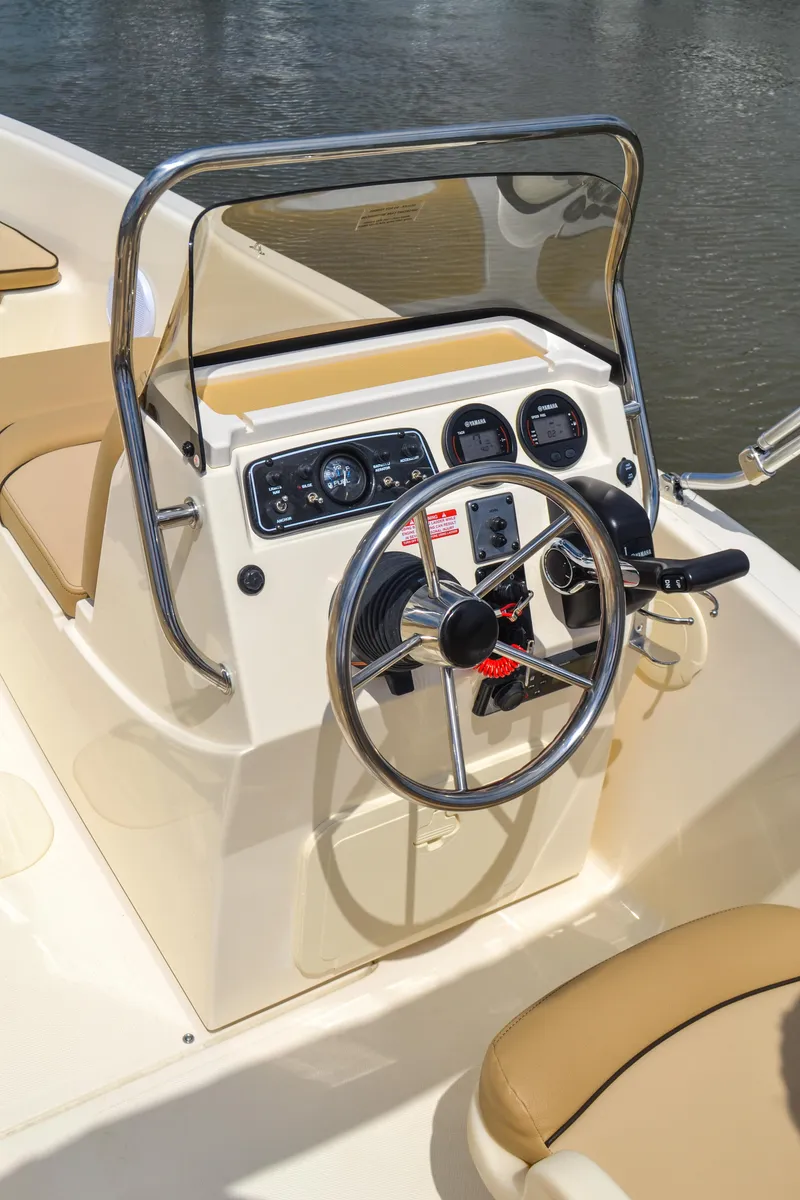 Slide: The Image of 2026 Scout 175 Sport Dorado helm with steering wheel and instruments. - 10