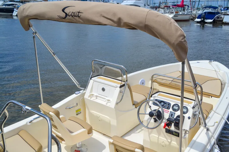 Slide: The Image of Scout 175 Sport Dorado 2026 boat in harbor, beige upholstery. - 14