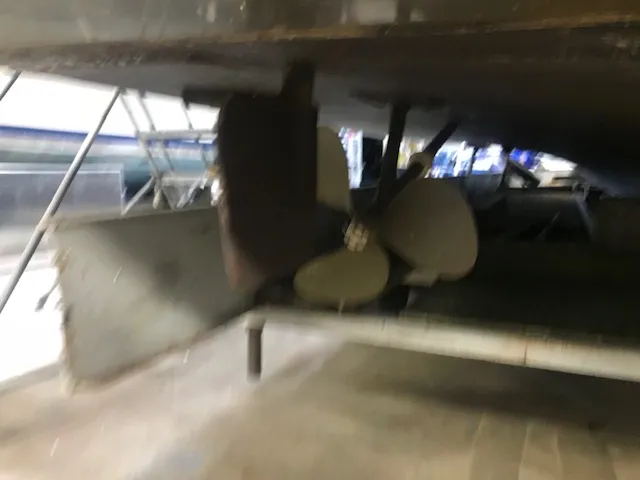 Slide: The Image of 1969 Chris-Craft Commander Sedan propeller and rudder in dry dock. - 11