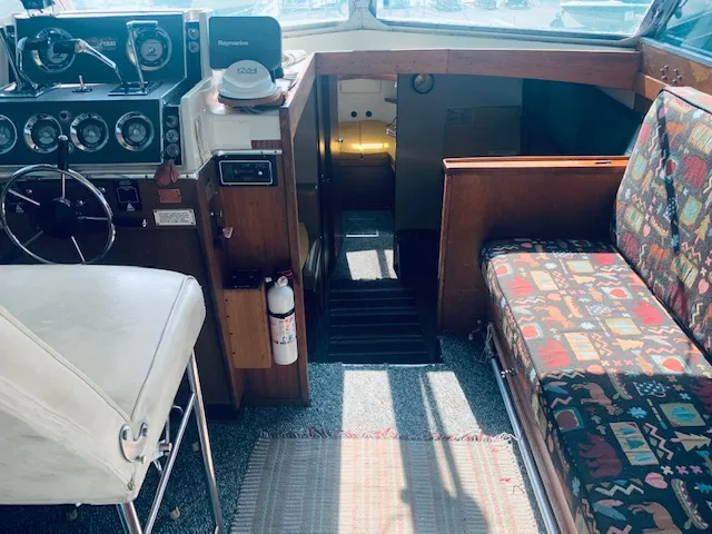 Slide: The Image of 1969 Chris-Craft Commander Sedan interior with vintage controls and patterned seating. - 13
