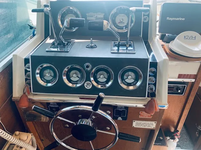 Slide: The Image of 1969 Chris-Craft Commander Sedan helm with vintage gauges and steering wheel. - 14