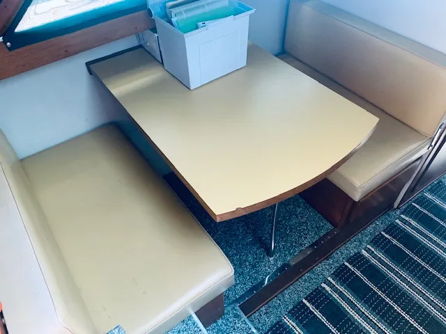 Slide: The Image of 1969 Chris-Craft Commander Sedan interior with beige seating and table. - 15