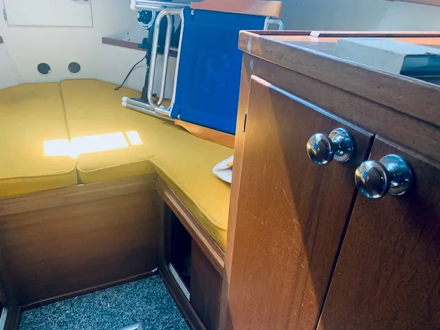 Slide: The Image of Interior of 1969 Chris-Craft Commander Sedan with yellow cushions and wooden cabinetry. - 17