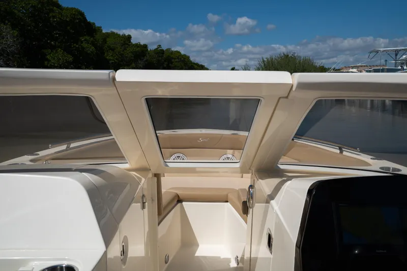 Slide: The Image of Scout 240 Dorado 2026 boat on calm water. - 13