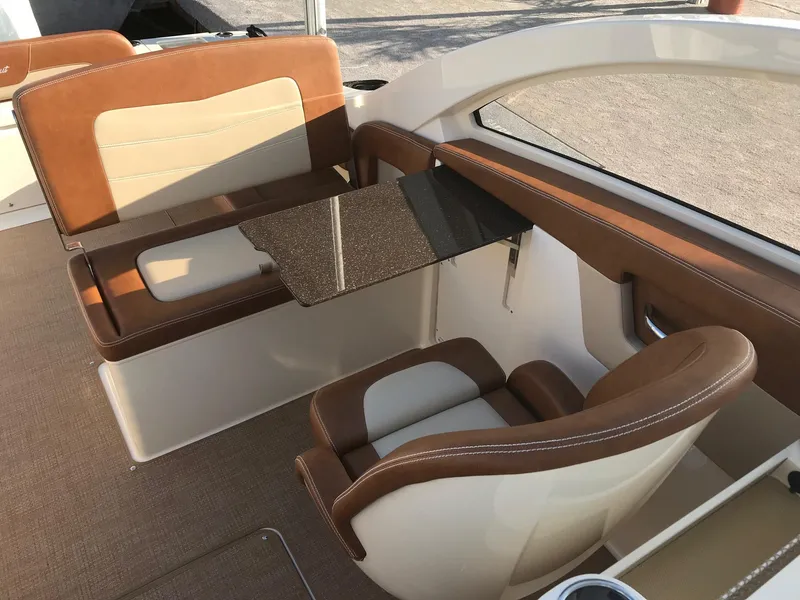 Slide: The Image of Interior of 2026 Scout 240 Dorado with brown leather seating. - 2