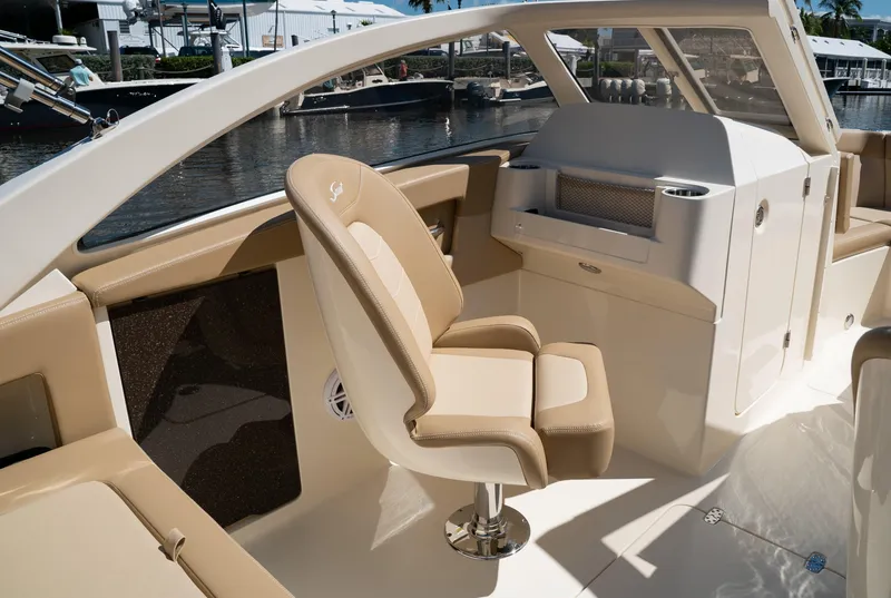 Slide: The Image of 2026 Scout 240 Dorado interior with beige seating. - 20