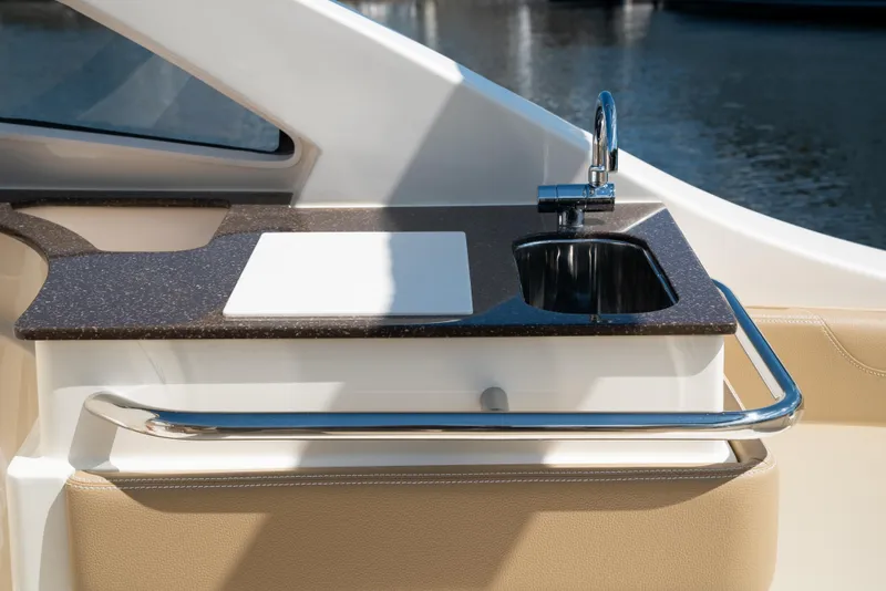 Slide: The Image of Scout 240 Dorado 2026 boat kitchenette with sink and countertop. - 27