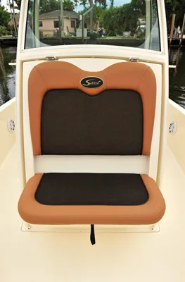 Slide: The Image of Scout 251XSS 2025 boat seat with brown and black upholstery. - 6