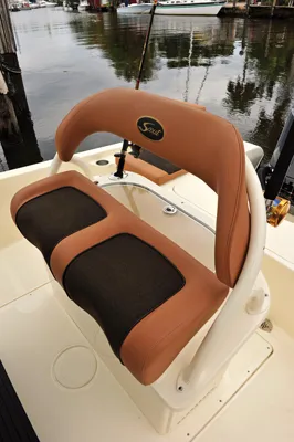 Slide: The Image of Scout 251XSS 2025 boat seat with brown upholstery. - 8