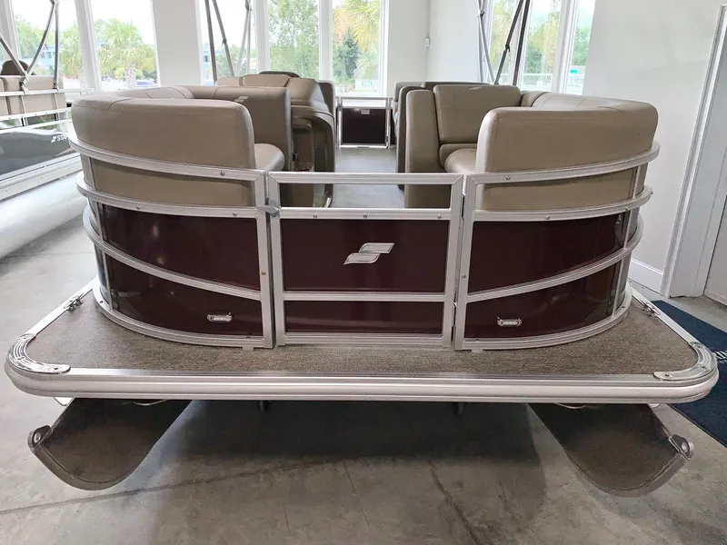 Slide: The Image of 2024 Starcraft LX22 R pontoon boat with beige seating and maroon exterior. - 2