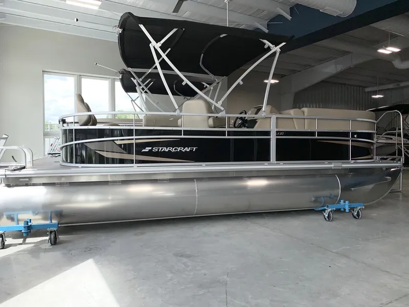 Slide: The Image of 2024 Starcraft LX20 F pontoon boat in showroom. - 0