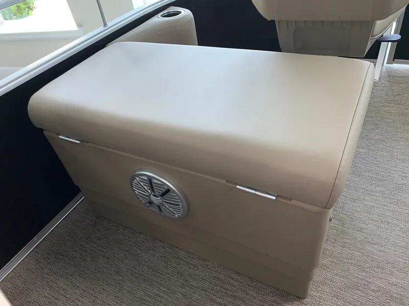 Slide: The Image of 2024 Starcraft LX20 F boat interior seating with built-in speaker. - 13