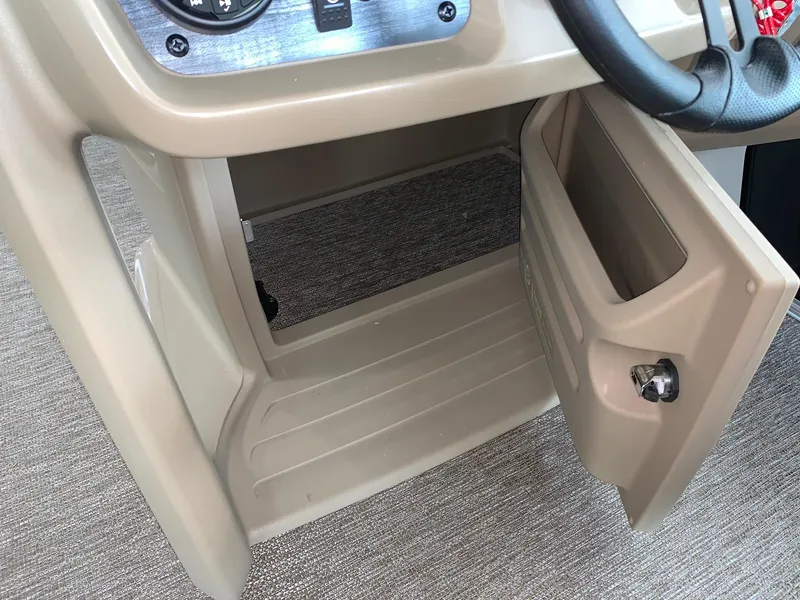 Slide: The Image of 2024 Starcraft LX20 F boat storage compartment with open door. - 9