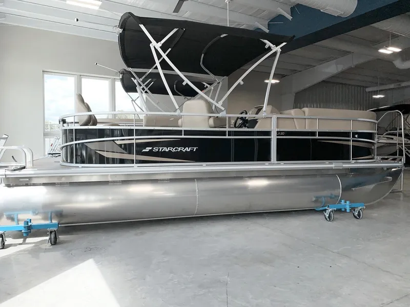 Slide: The Image of 2024 Starcraft LX20 F pontoon boat in showroom. - 0