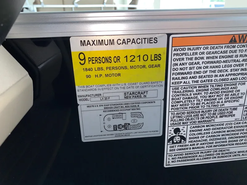 Slide: The Image of 2024 Starcraft LX20 F boat capacity label, 9 persons or 1210 lbs, 90 HP motor. - 17