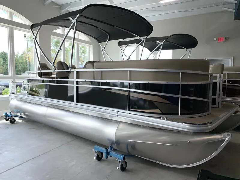 Slide: The Image of 2024 Starcraft LX20 F pontoon boat in showroom. - 3