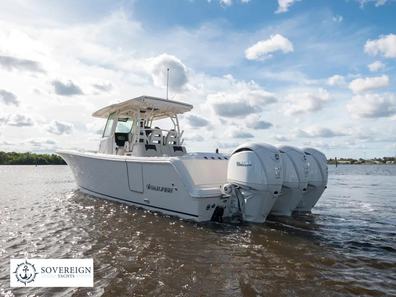 Slide: The Image of 2024 Sailfish 360 CC boat on water with triple outboard engines. - 22