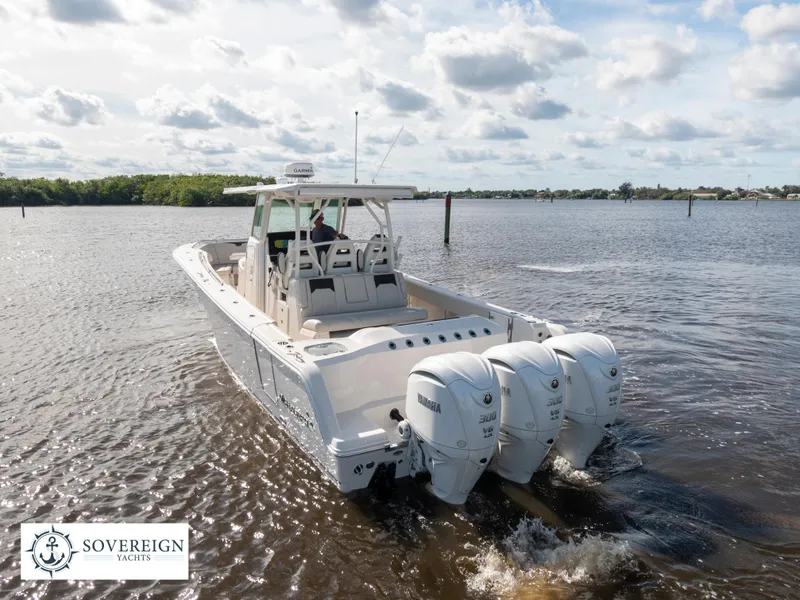 Slide: The Image of 2024 Sailfish 360 CC boat with triple Yamaha engines on the water. - 23