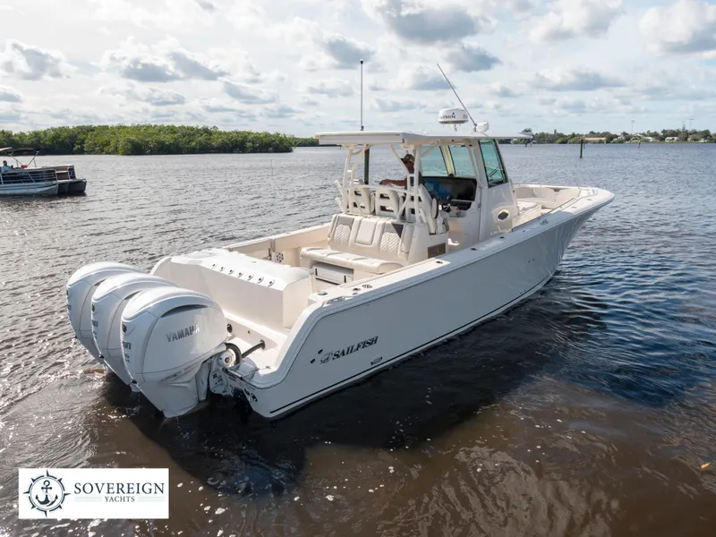 Slide: The Image of 2024 Sailfish 360 CC boat with twin Yamaha engines on the water. - 26