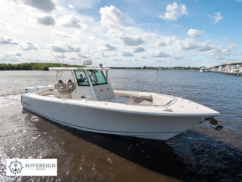 Slide: The Image of 2024 Sailfish 360 CC boat on calm waters, showcased by Sovereign Yachts. - 30