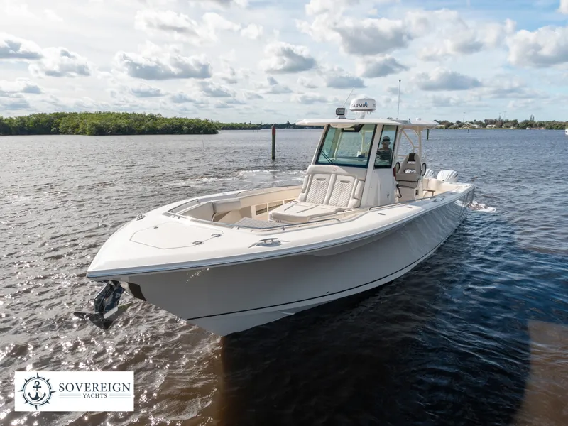 Slide: The Image of 2024 Sailfish 360 CC boat on water, Sovereign Yachts logo. - 32