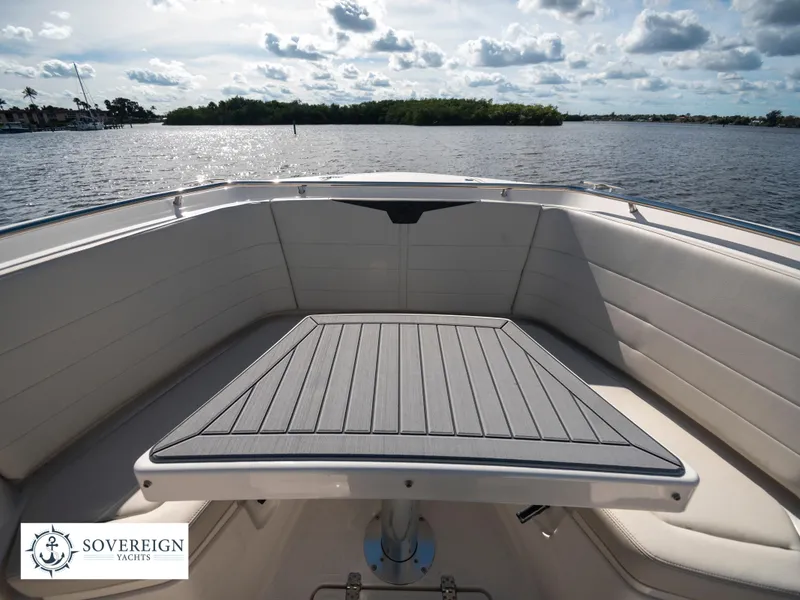 Slide: The Image of 2024 Sailfish 360 CC boat interior with table and seating, Sovereign Yachts. - 34
