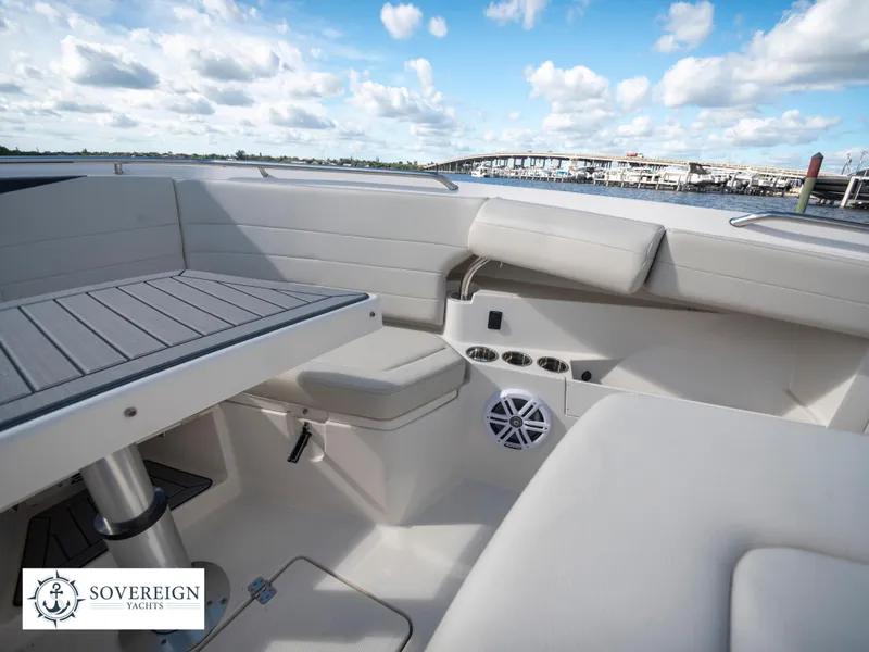 Slide: The Image of 2024 Sailfish 360 CC boat interior with seating and table, Sovereign Yachts logo. - 35