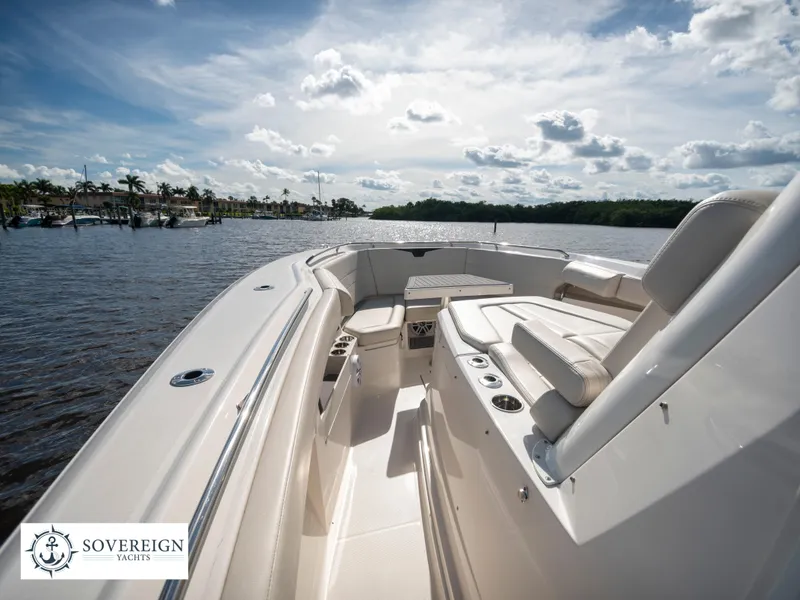 Slide: The Image of 2024 Sailfish 360 CC boat interior on a sunny day, Sovereign Yachts logo. - 39
