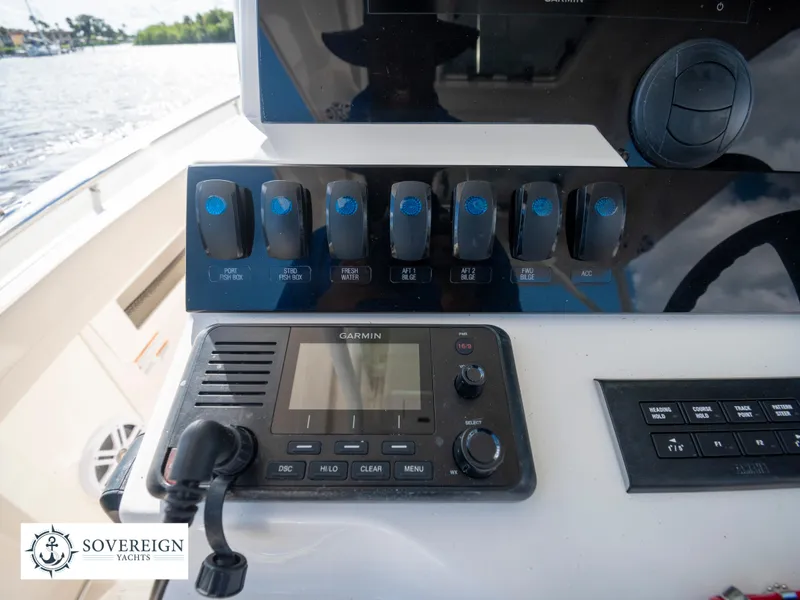 Slide: The Image of Control panel of a 2024 Sailfish 360 CC boat with Garmin navigation system. - 44
