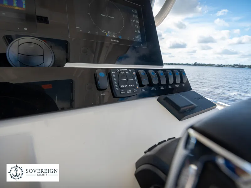 Slide: The Image of Close-up of the control panel on a 2024 Sailfish 360 CC boat. - 46