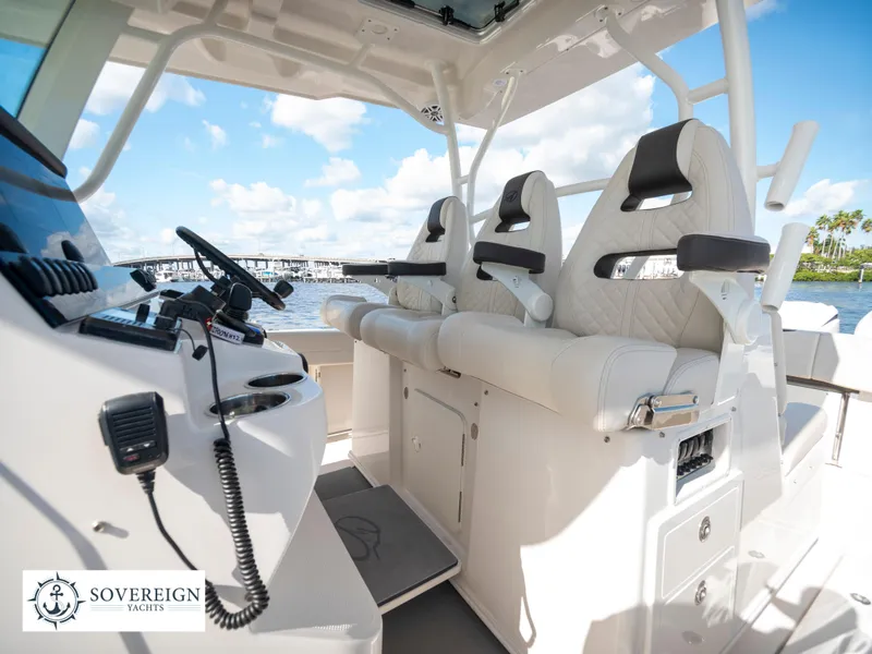 Slide: The Image of 2024 Sailfish 360 CC boat interior with helm and seating, Sovereign Yachts. - 47