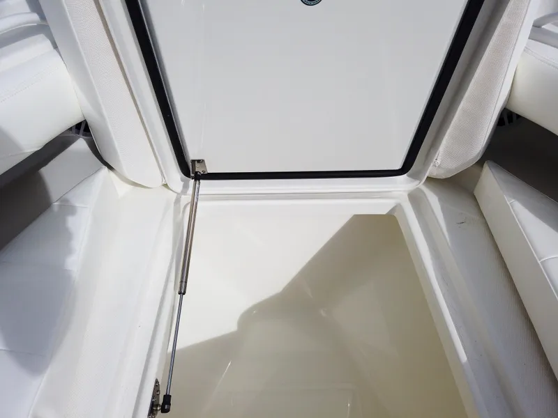Slide: The Image of Open storage compartment on a 2023 Regulator 28 boat. - 12