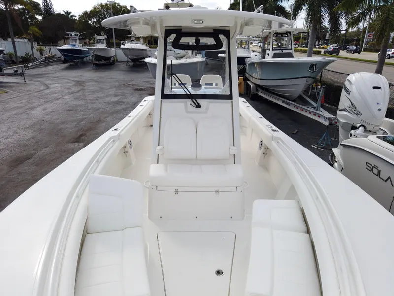 Slide: The Image of 2023 Regulator 28 boat with white seating and center console. - 15