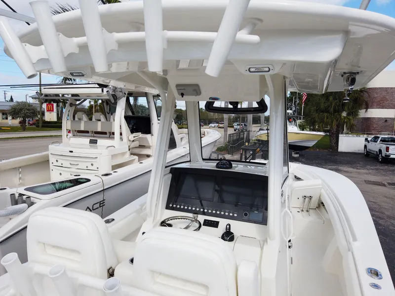 Slide: The Image of 2023 Regulator 28 boat cockpit with modern controls and seating. - 18