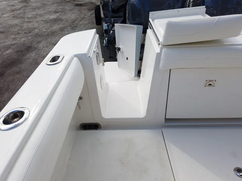 Slide: The Image of 2023 Regulator 28 boat interior, featuring seating and storage compartments. - 19