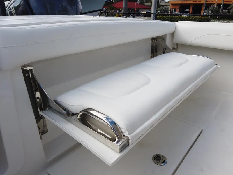Slide: The Image of 2023 Regulator 28 boat with fold-down white cushioned seat - 22