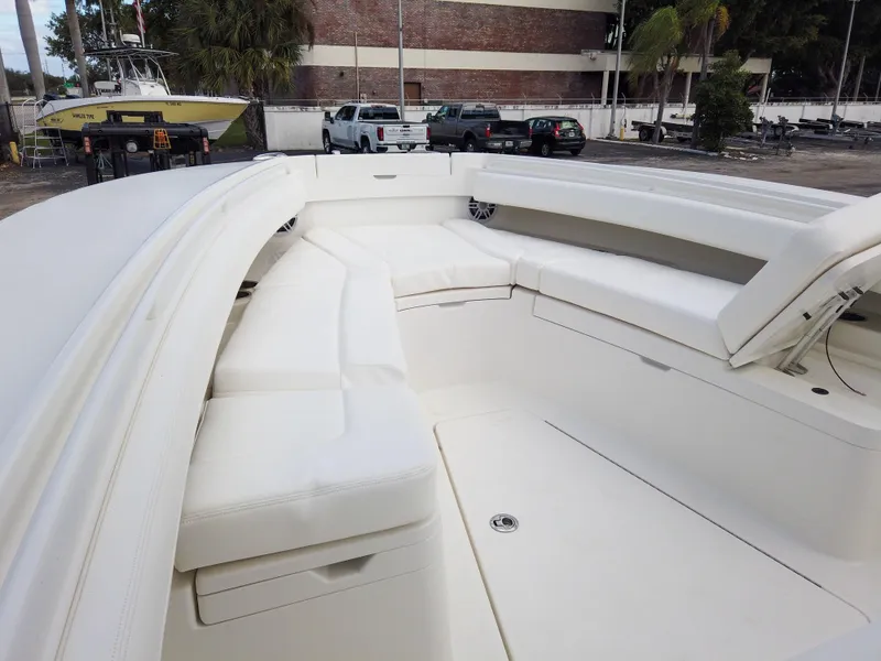 Slide: The Image of 2023 Regulator 28 boat with spacious white seating area. - 38