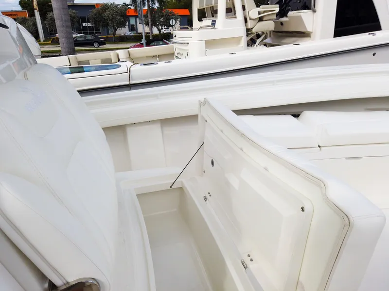 Slide: The Image of 2023 Regulator 28 boat interior with open storage compartment. - 42