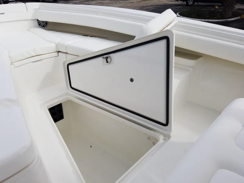 Slide: The Image of 2023 Regulator 28 boat with open storage compartment. - 43