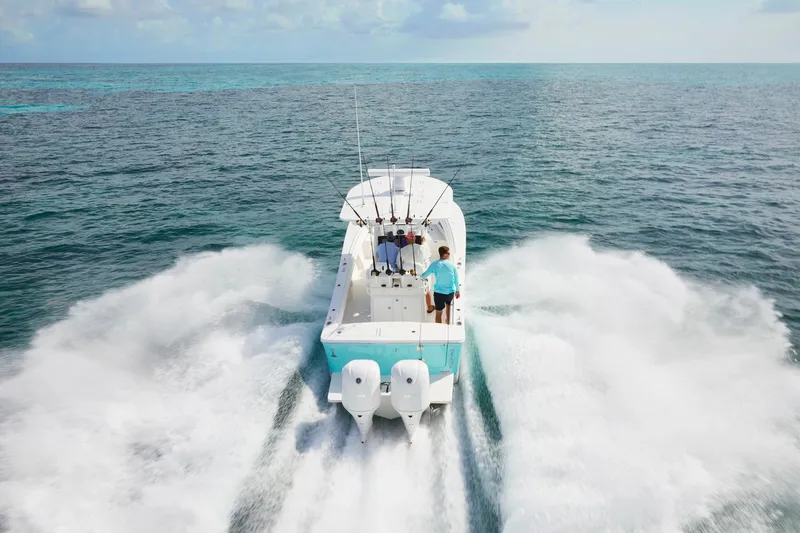 Slide: The Image of 2023 Regulator 28 boat speeding on open water. - 46