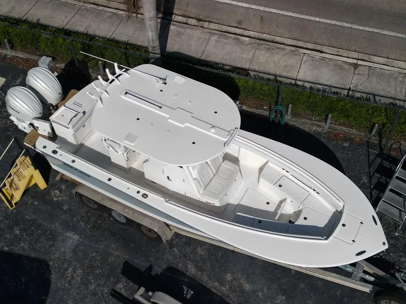 Slide: The Image of 2023 Regulator 28 boat, aerial view, docked on trailer. - 47