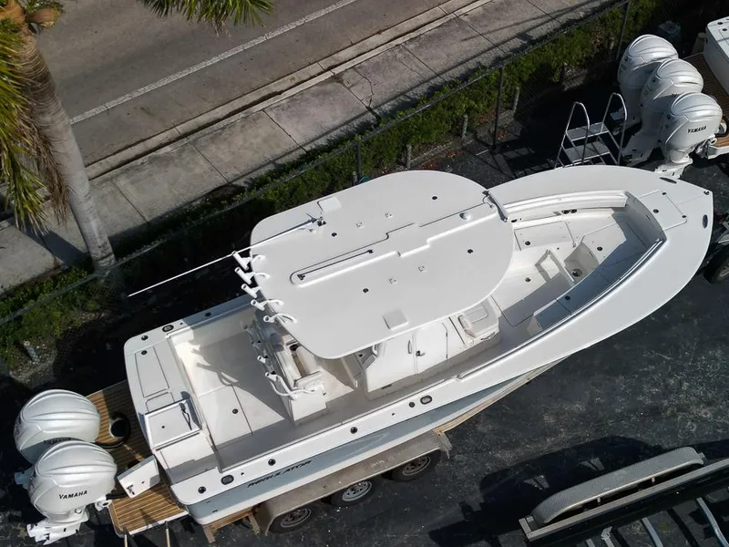 Slide: The Image of 2023 Regulator 28 boat with dual Yamaha outboard engines, aerial view. - 48